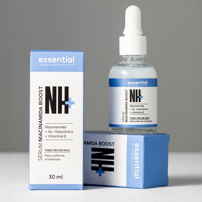 NH+ niacinamide boost serum bottle and packaging on a gray background